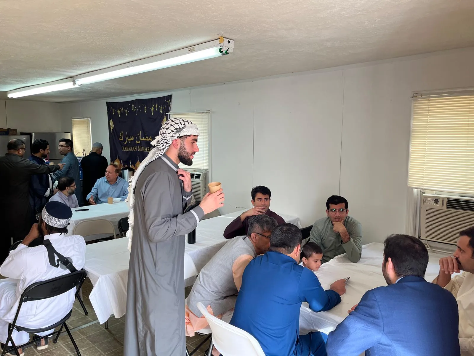 A speaker addressing community members