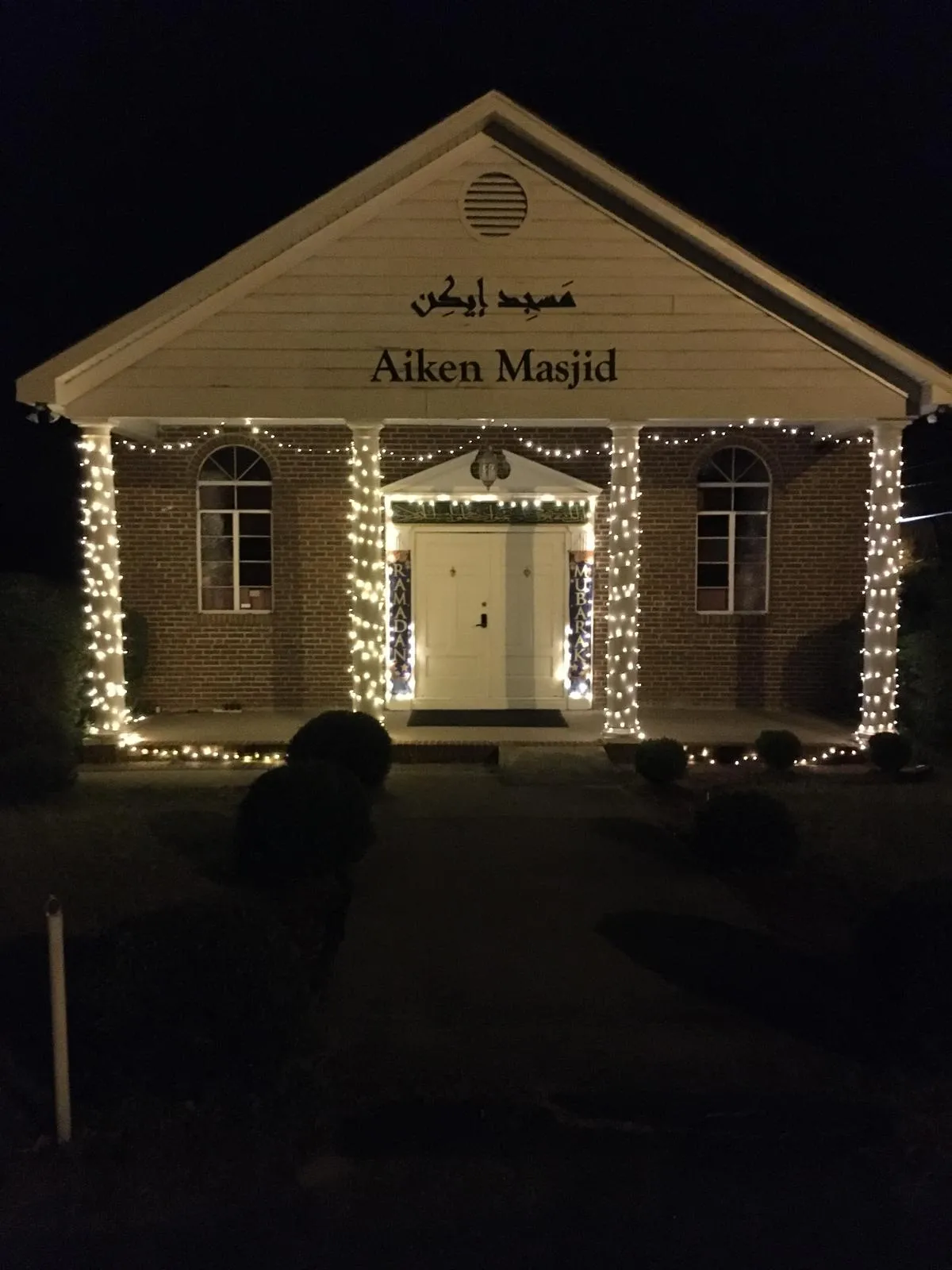 Aiken Masjid lit for a nighttime celebration