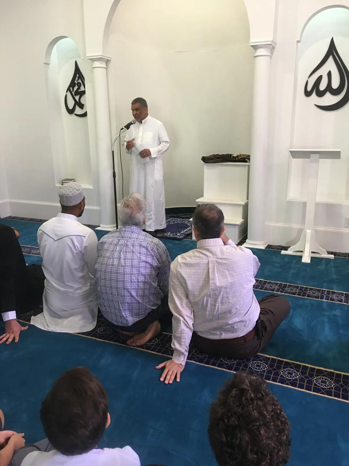 Congregants standing in prayer