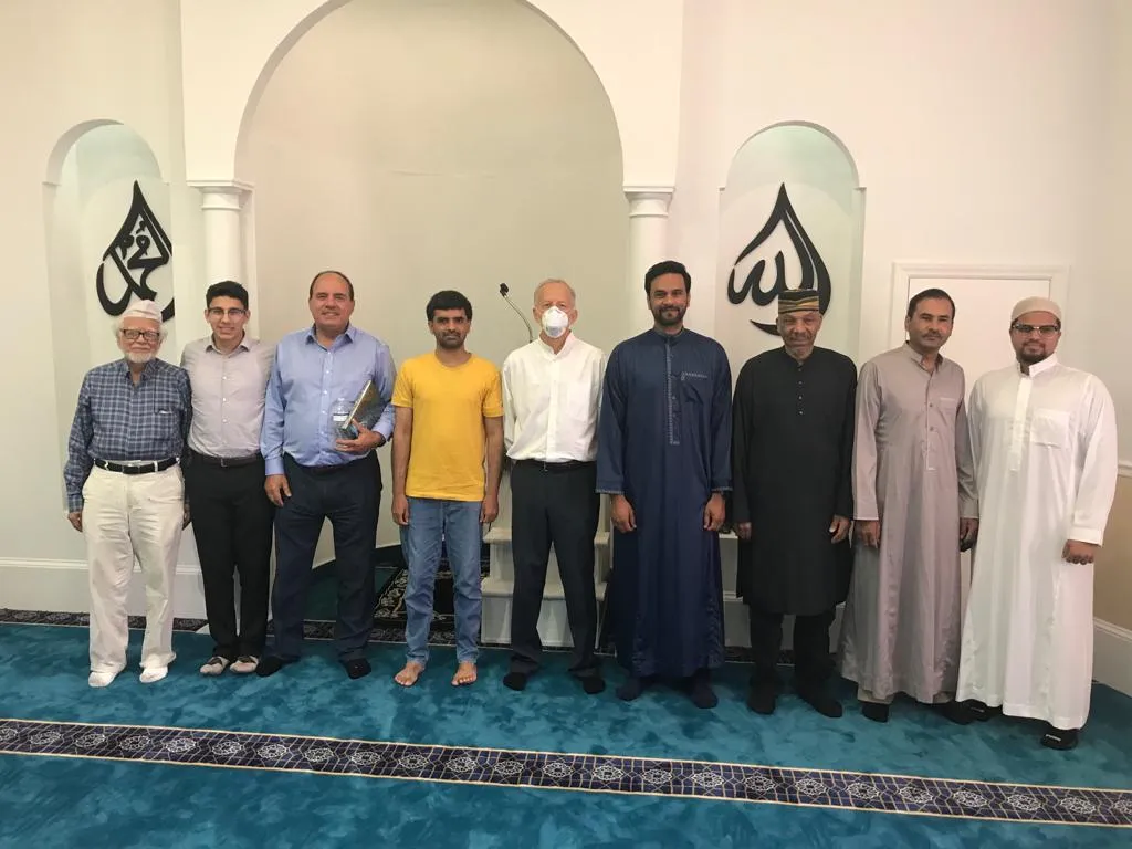 A group of community members inside Aiken Masjid