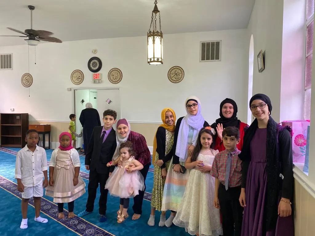 Families gathered in the prayer hall