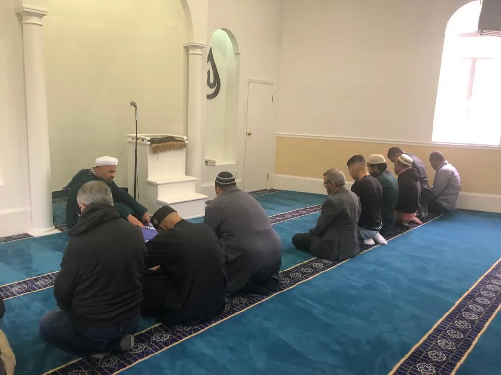 Congregants seated during prayer