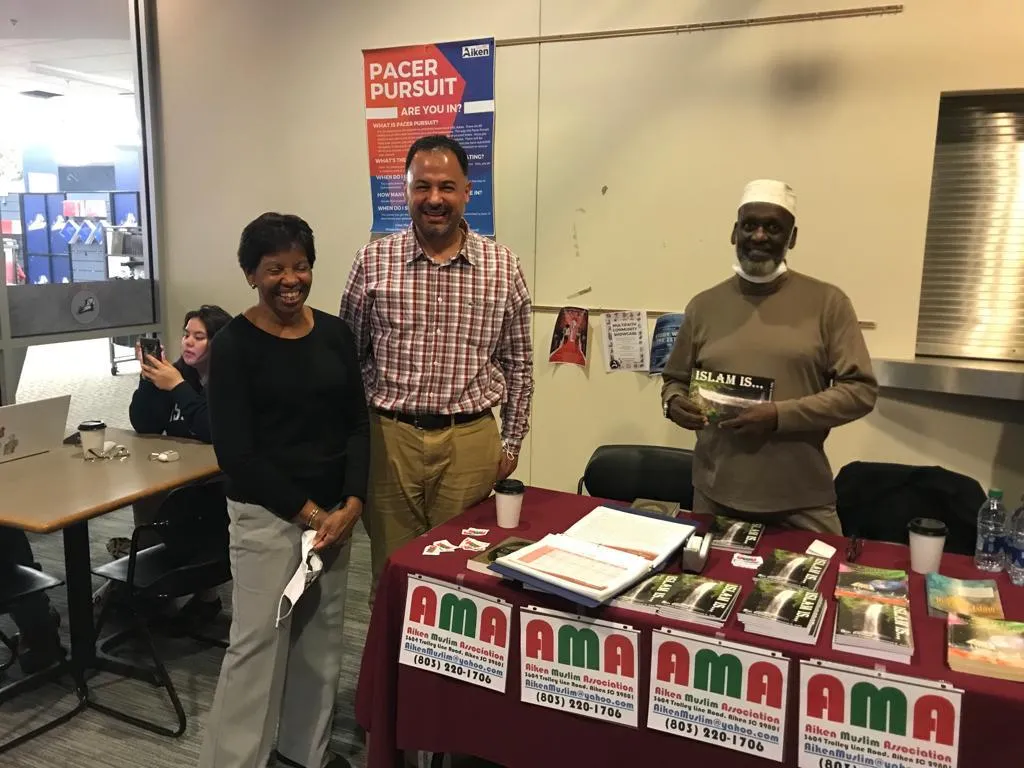 Community members at an outreach table